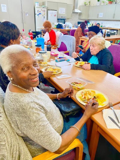 Residents eating at a Southwark Senior Social Association event