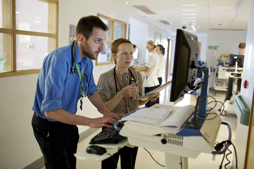 Clinicians looking at computer together