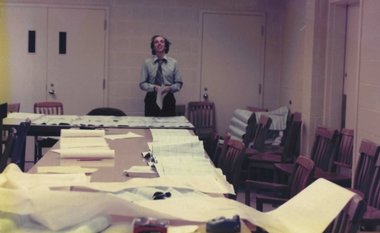 John Moxham sorting through paper records 1970s